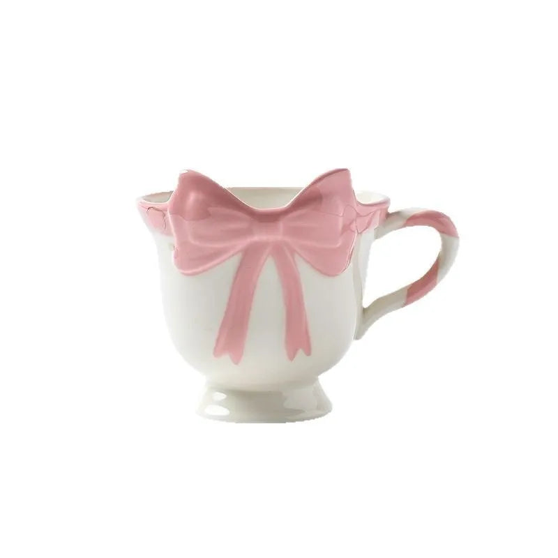 Ceramic mug with girl heart bow decoration in white powder or black pink colour, 301-400ml capacity.