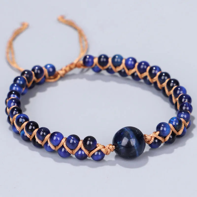 Handmade woven geometric bracelet with blue Tigereye beads and an adjustable pull fastening.