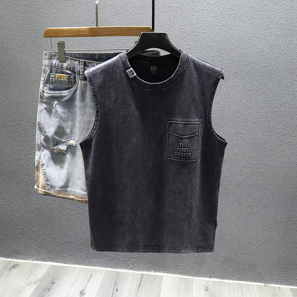 A white loose-fit cotton sleeveless t-shirt with a straight hem, laid flat.