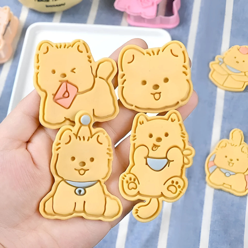 Three-dimensional plastic biscuit mould with cartoon puppy designs including birthday hat and swimming ring patterns