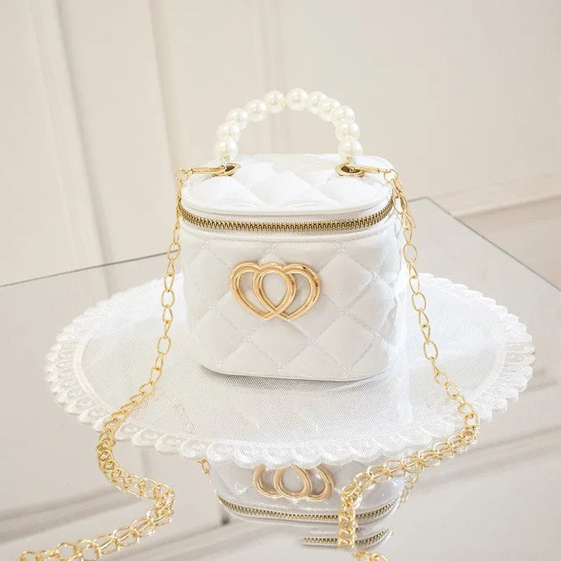 Heart-shaped pattern on a PVC bucket-style gel cosmetic bag in apricot colour.