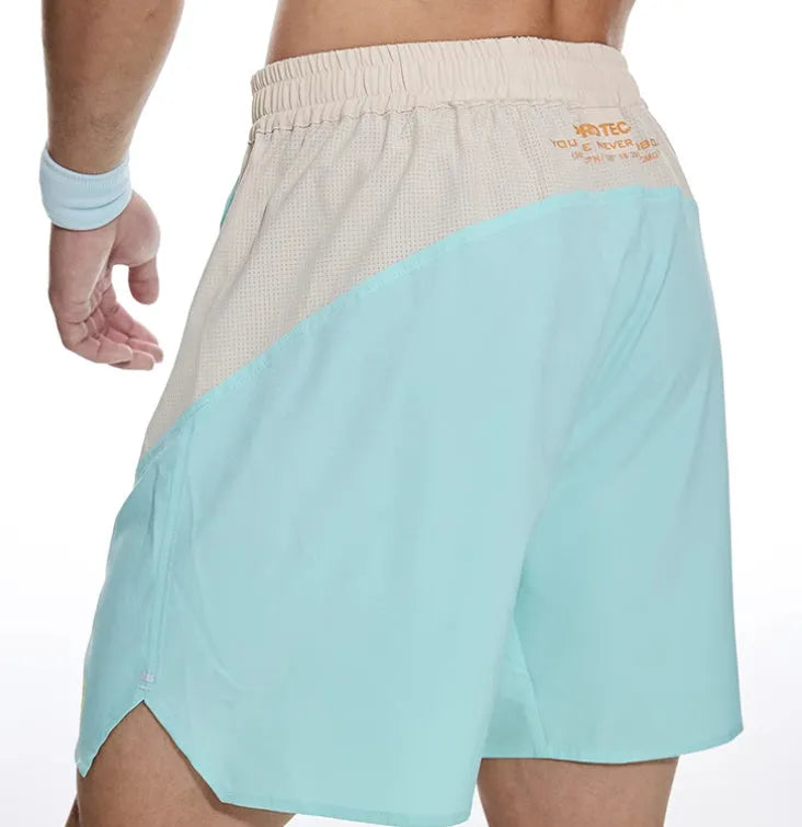 Men's loose grey workout shorts with elastic and lace-up waistband for gym training.