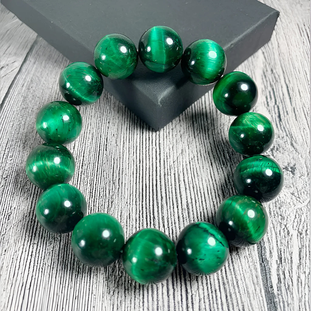 Green tiger eye stone bracelet with polished geometric beads in natural stone material