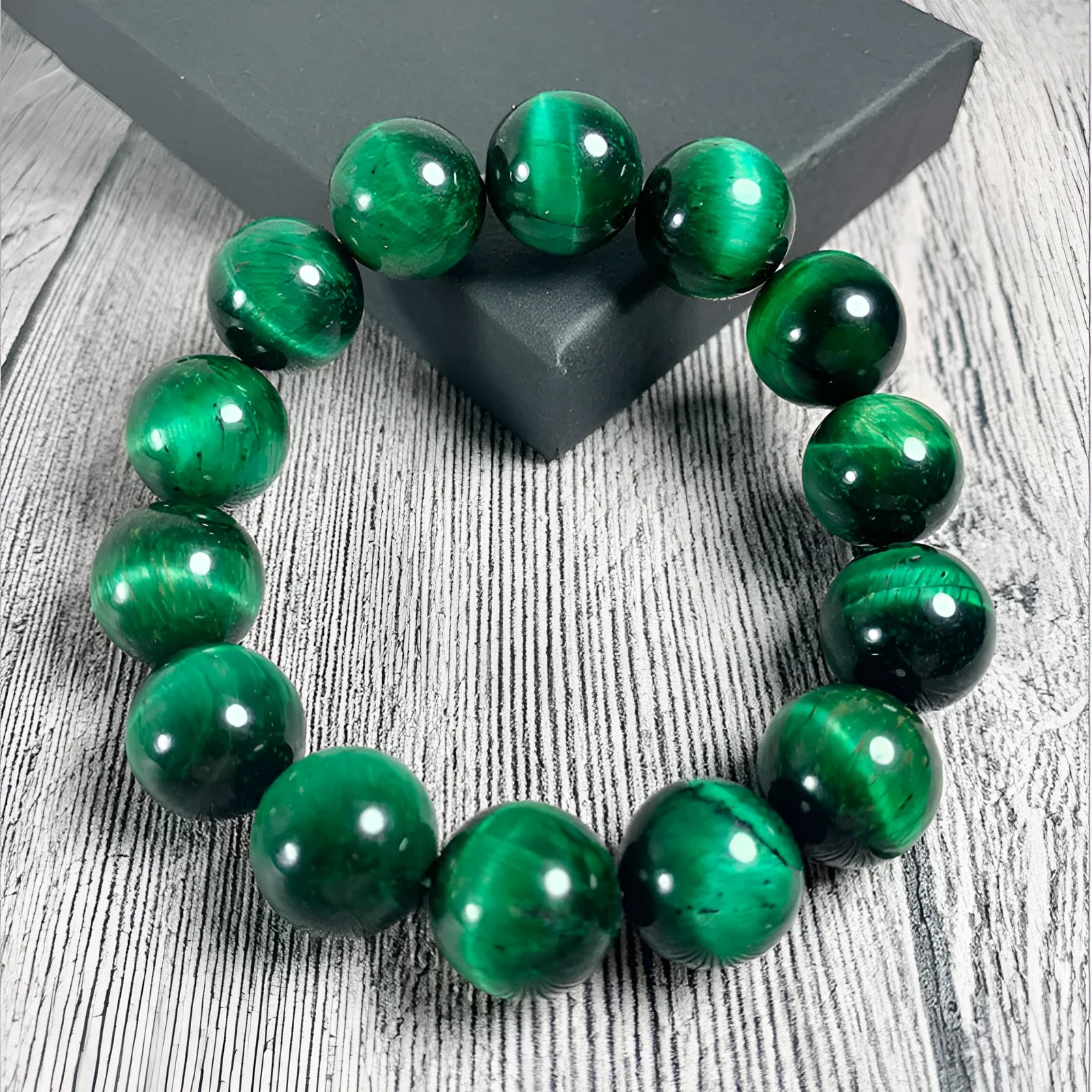 Green tiger eye stone bracelet with polished geometric beads in natural stone material