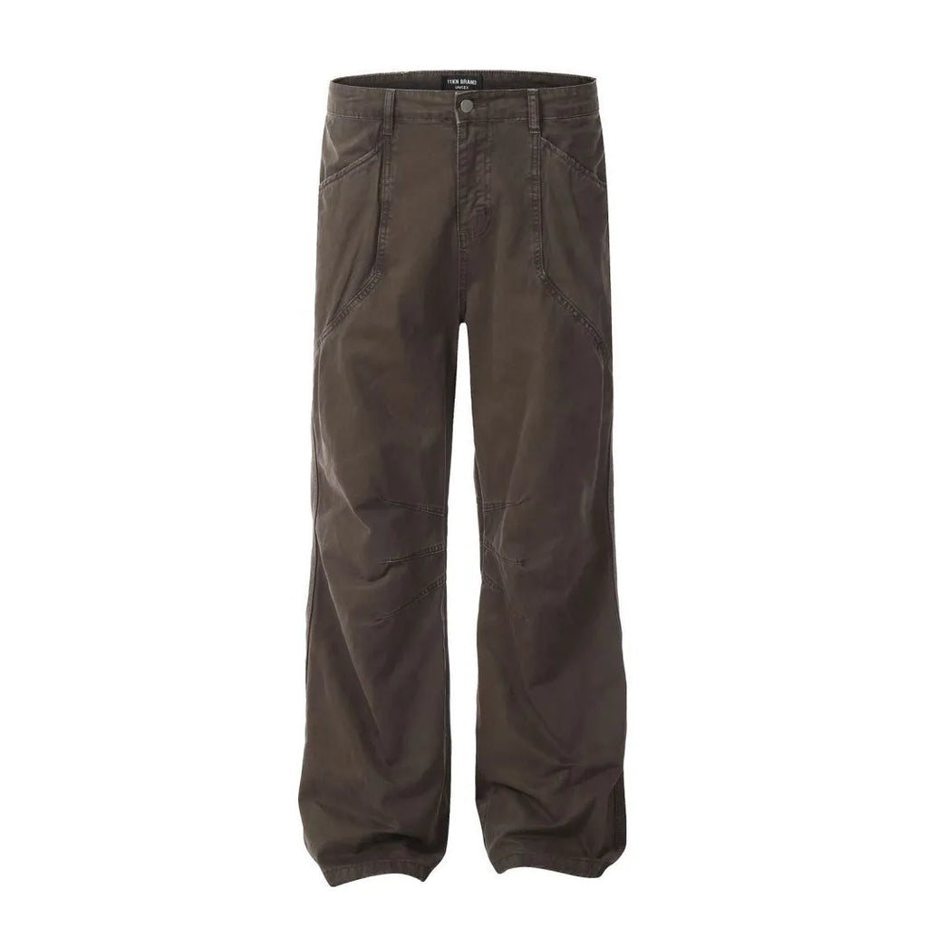 Men's brown loose straight-leg cotton trousers with a high waist and zipper fly.