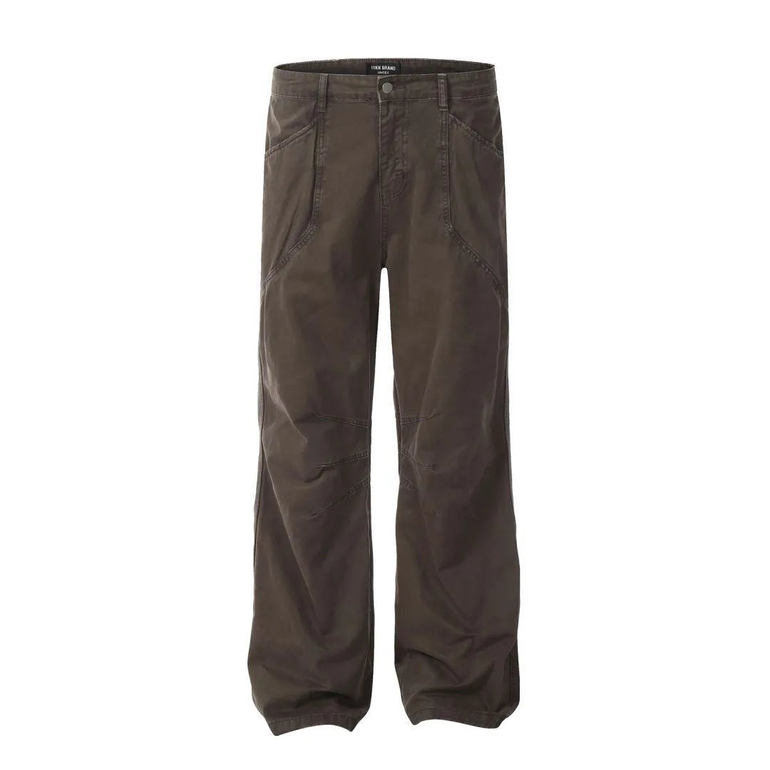 Men's brown loose straight-leg cotton trousers with a high waist and zipper fly.
