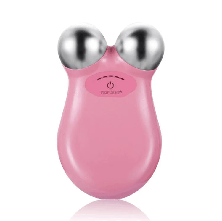 Pink micro current facial lifting device with compact shape on white background
