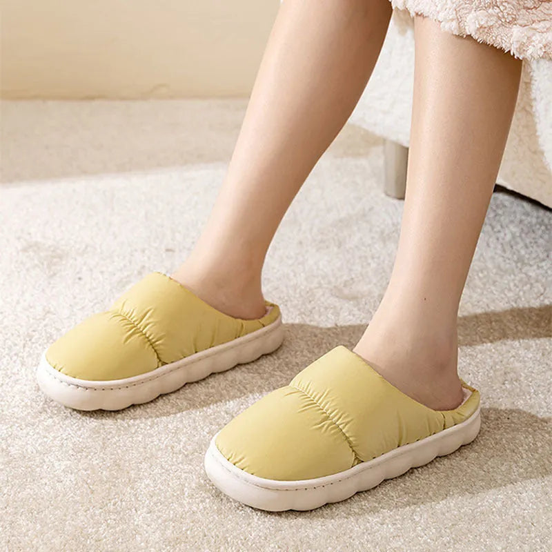 Pair of down cotton winter slippers with a thick rubber non-slip sole, shown in a choice of colours.