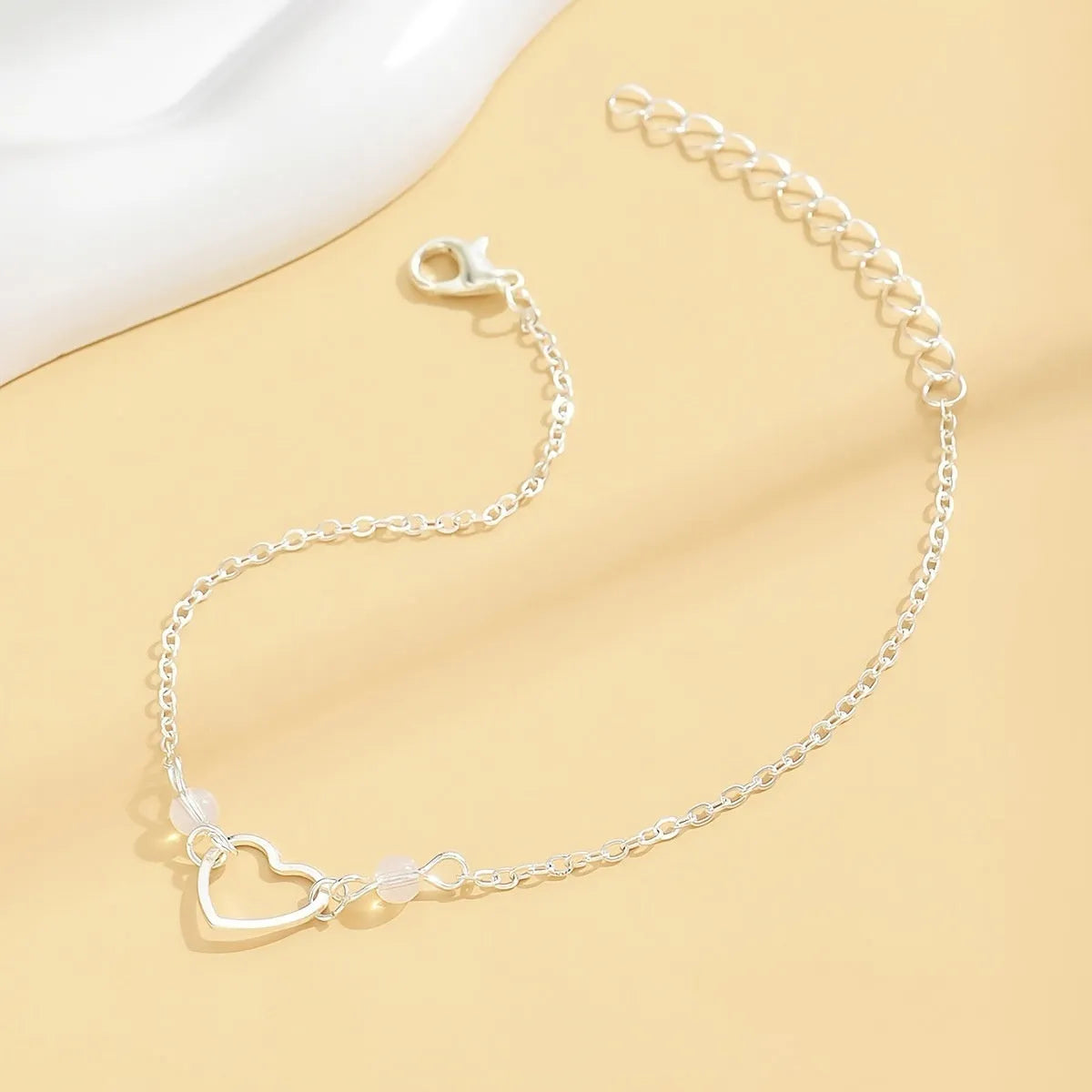 Women's adjustable anklet with heart pendant in gold or silver colour