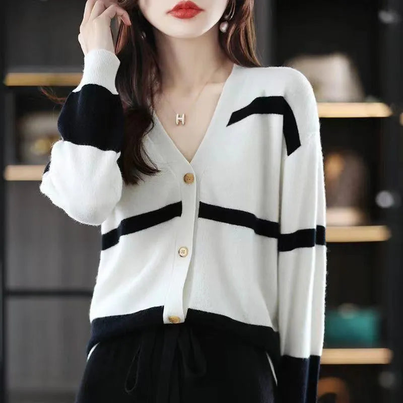 Women's striped V-neck knitted cardigan in a slim fit, showing 3D pattern detail.