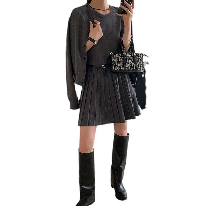 Women's grey knitted vest skirt and cardigan two-piece set with pleated design and belt