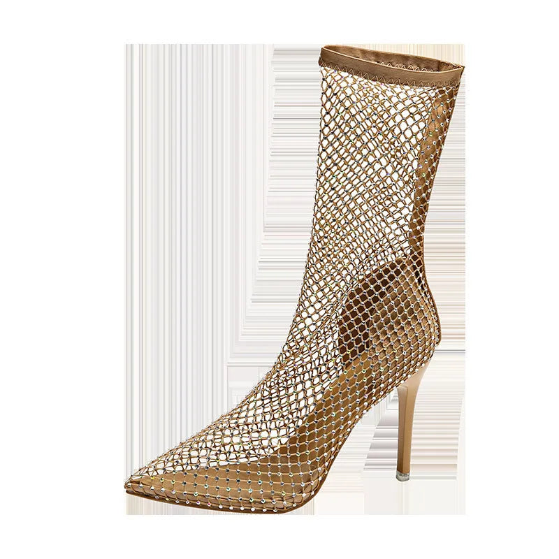 Gold women's stiletto high heel sandals with mesh upper and pointed toe on a rubber sole.