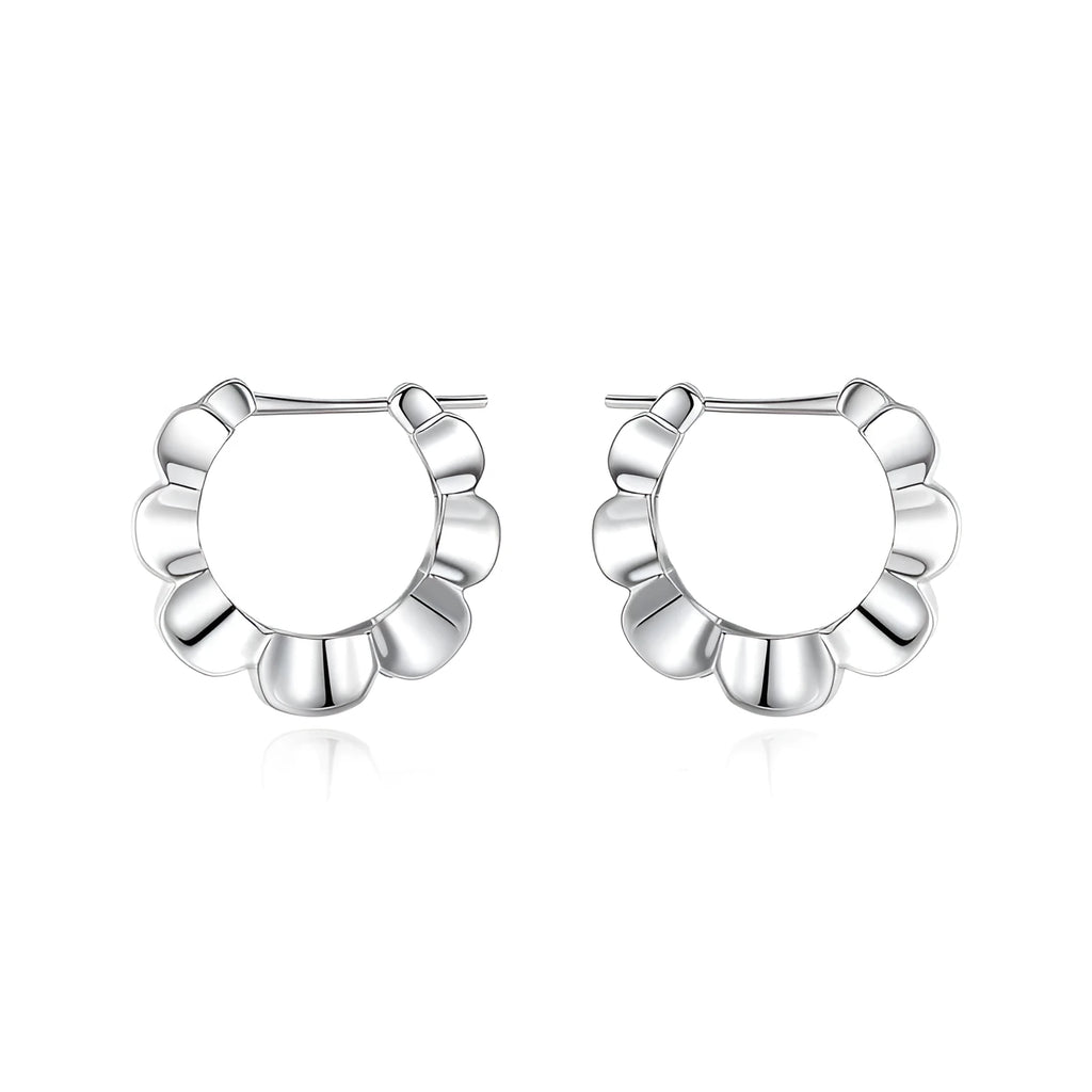 A pair of sterling silver geometric earrings with round details in a retro style.