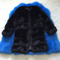 Women's long black artificial fur coat with regular sleeves, shown on a model.