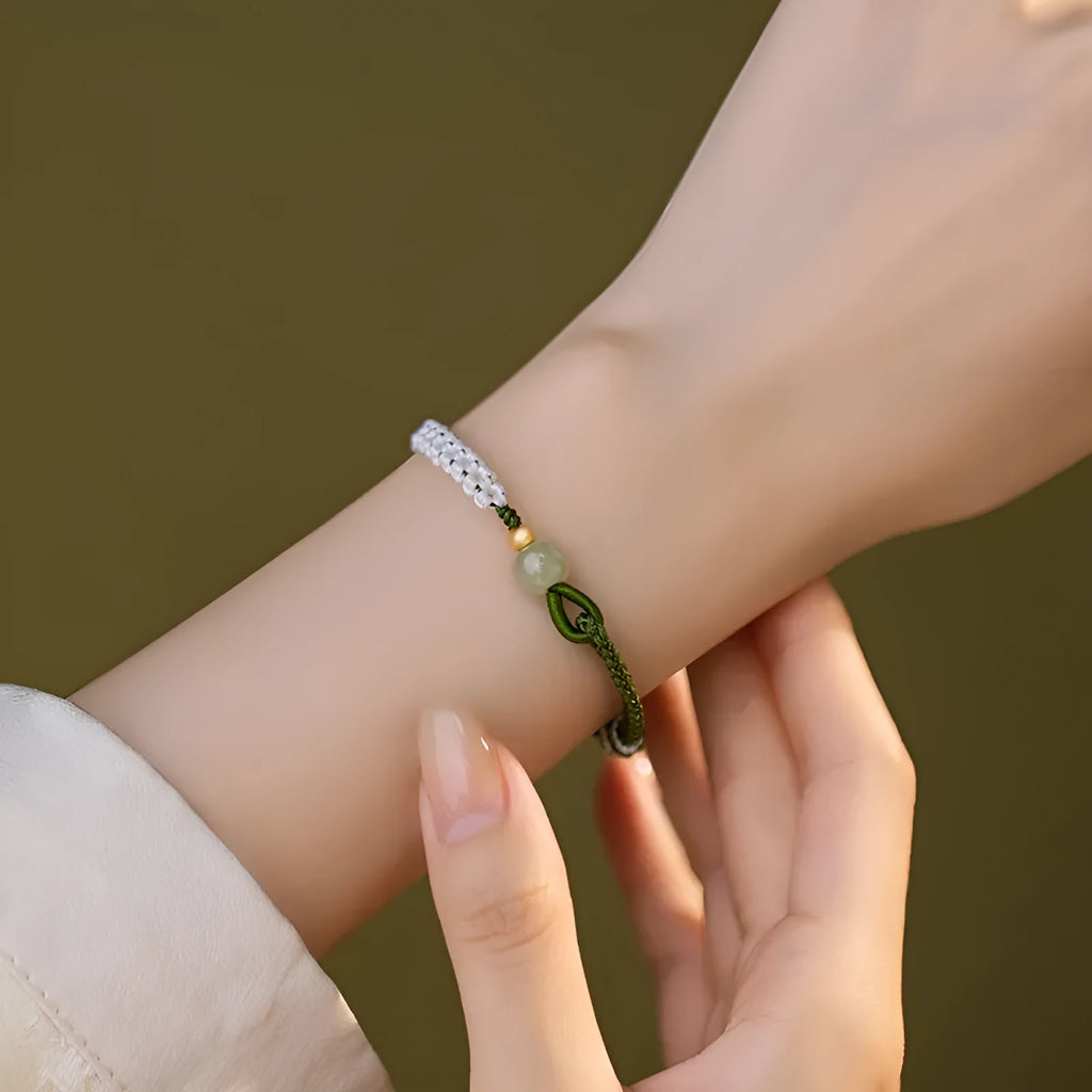 Women's Chinese national bracelet with Hetian jade, sterling silver, and colourful cord carrying strap