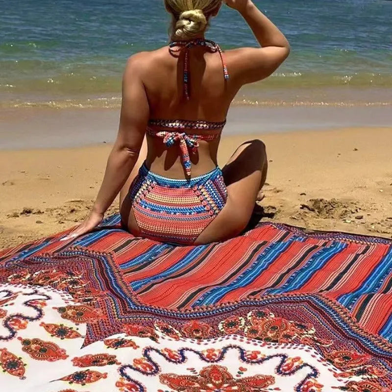 Women's three-piece swimsuit set with cutout sleeveless top, high-waisted briefs, and matching coat on a model.