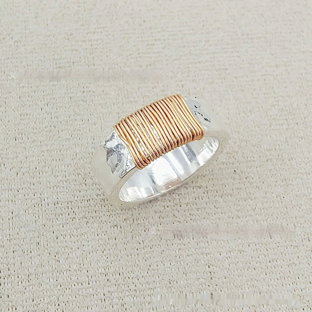 Copper geometric bracelet with irregular coil design in electroplated silver gold colour
