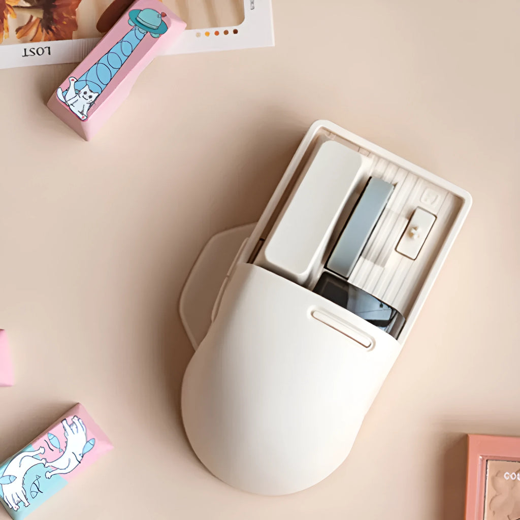 Xiaoqiao Tofu colour wireless mouse with 7 buttons and scroll wheel on plain background