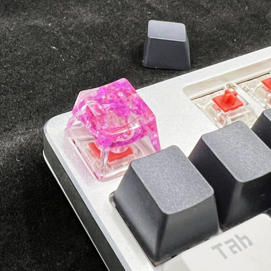 Transparent resin mechanical keyboard keycap showing starry sky galaxy design in multiple colour options