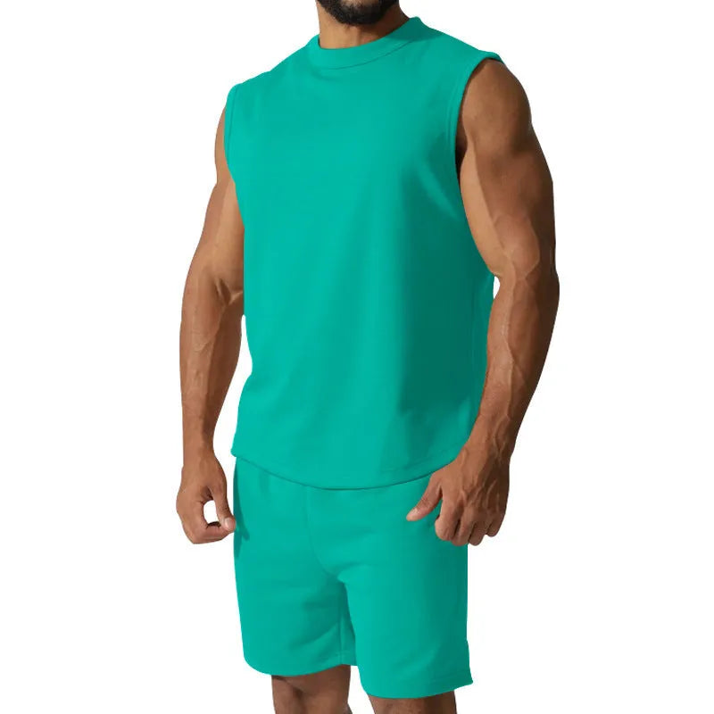 Men's sleeveless cotton blend sports top and shorts set in a solid colour on a mannequin.