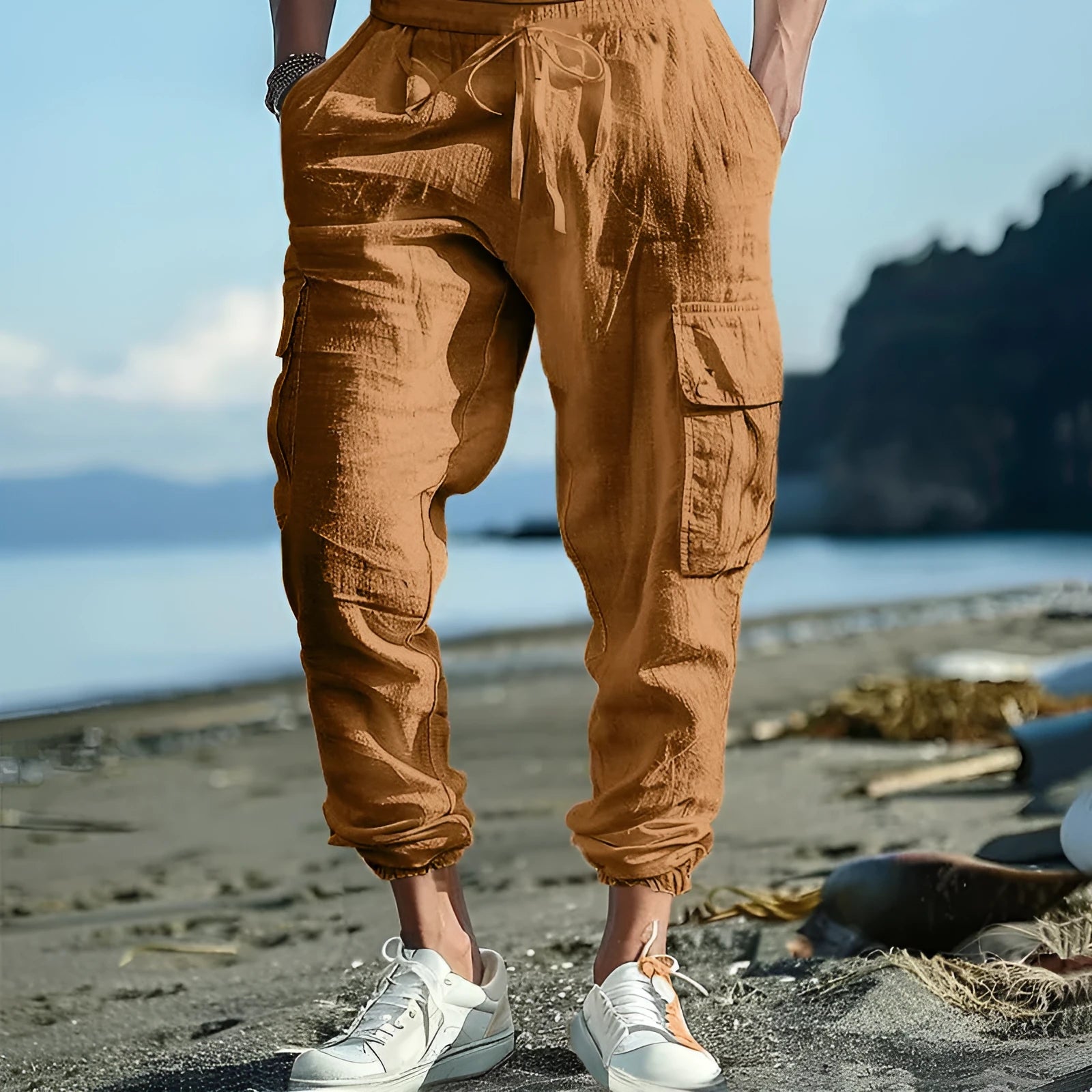 Men's loose-fit linen trousers with ankle ties and multiple pockets in Army Green.