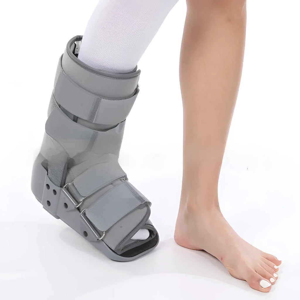 Grey Achilles tendon rehabilitation walking boot with aluminium supports and nylon straps.