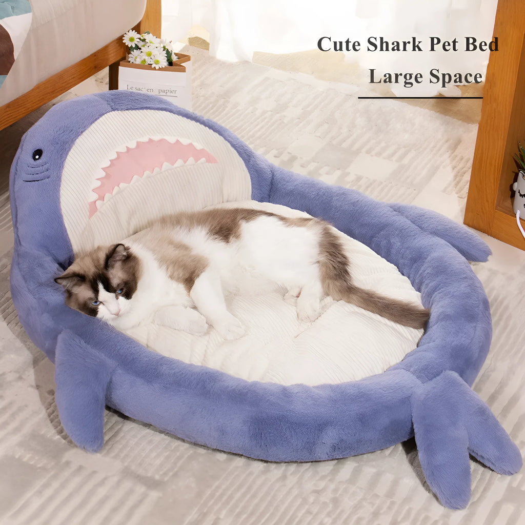 Blue shark pattern velvet pet bed cushion with thick padding on a wooden floor