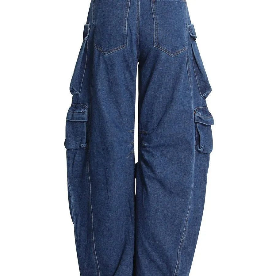 Dark blue distressed wide-leg women's jeans with a high waist and multiple pockets on a hanger.