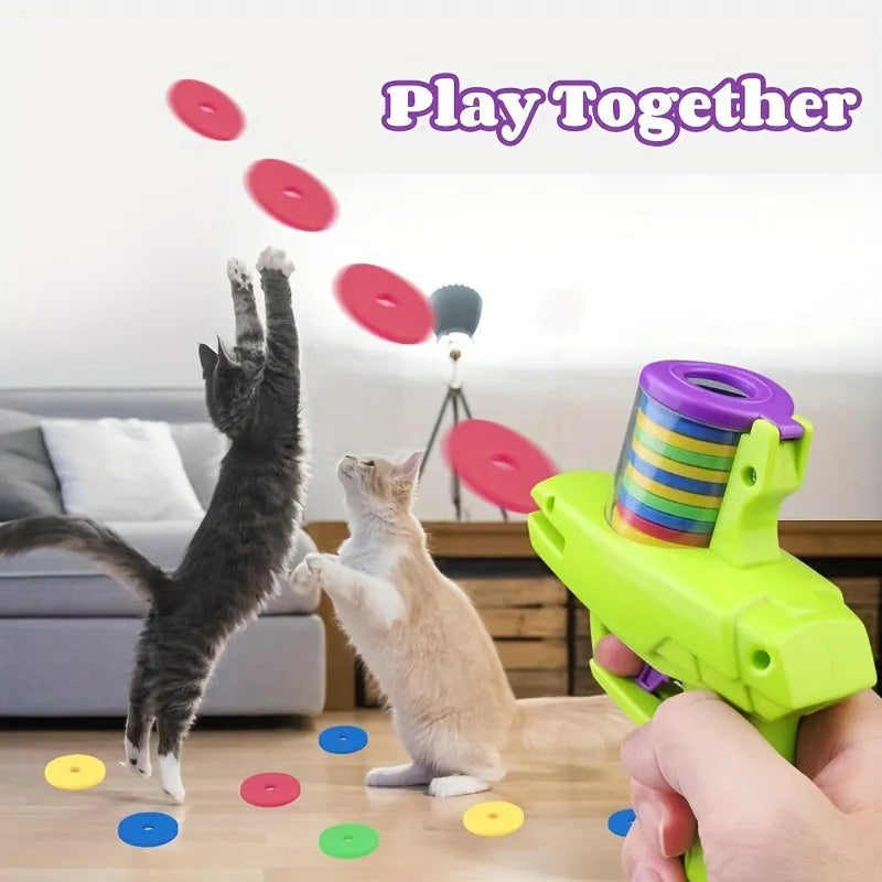 Green or purple battery-free cat toy launcher with foam disc and three foam balls