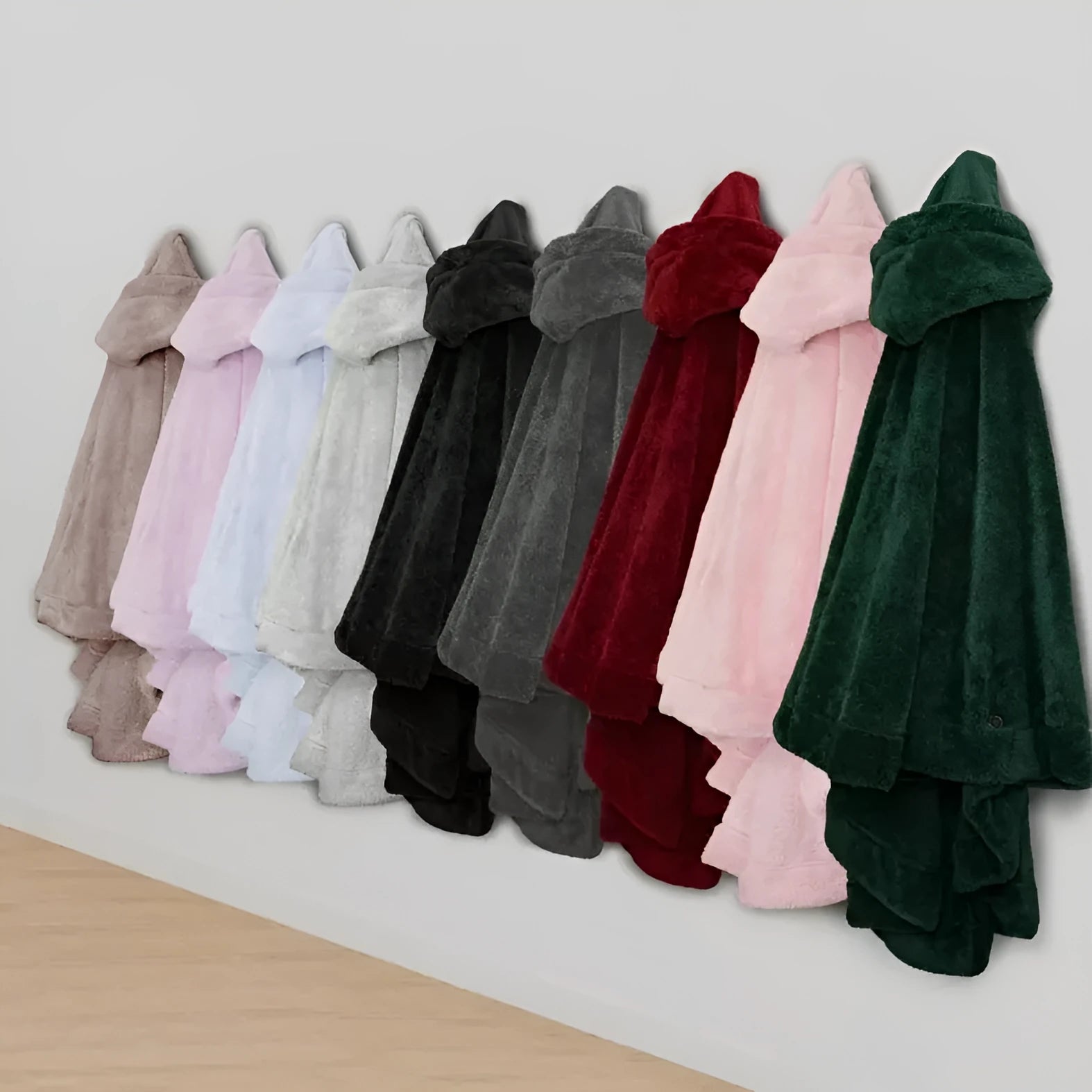 A super thick hooded bathrobe for adults in a free size, shown in black, dark grey, or pink.