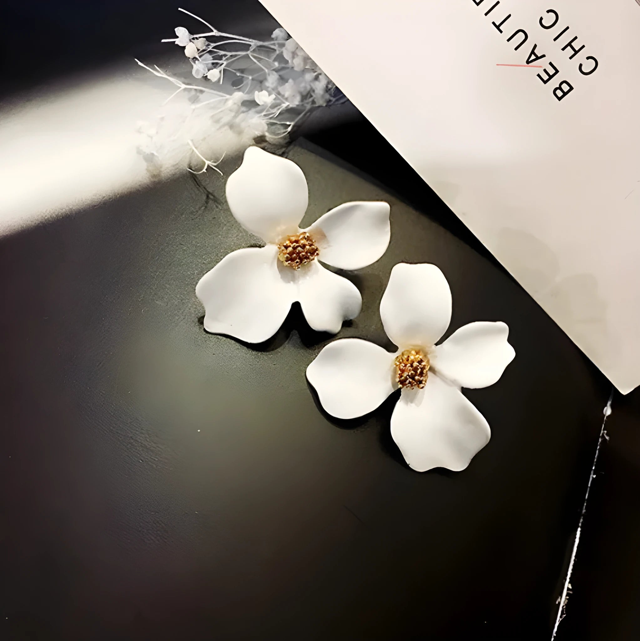 Flower-shaped stud earrings for women in pink or white colour with electroplated alloy construction