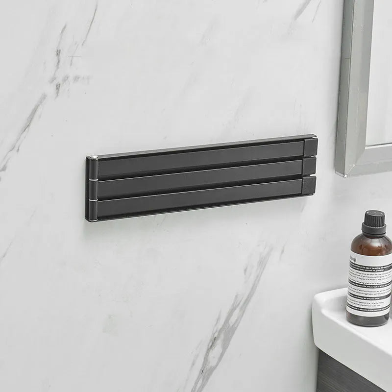 Nordic non-perforated folding towel bar in carbon steel with nail-free glue installation, black or white option