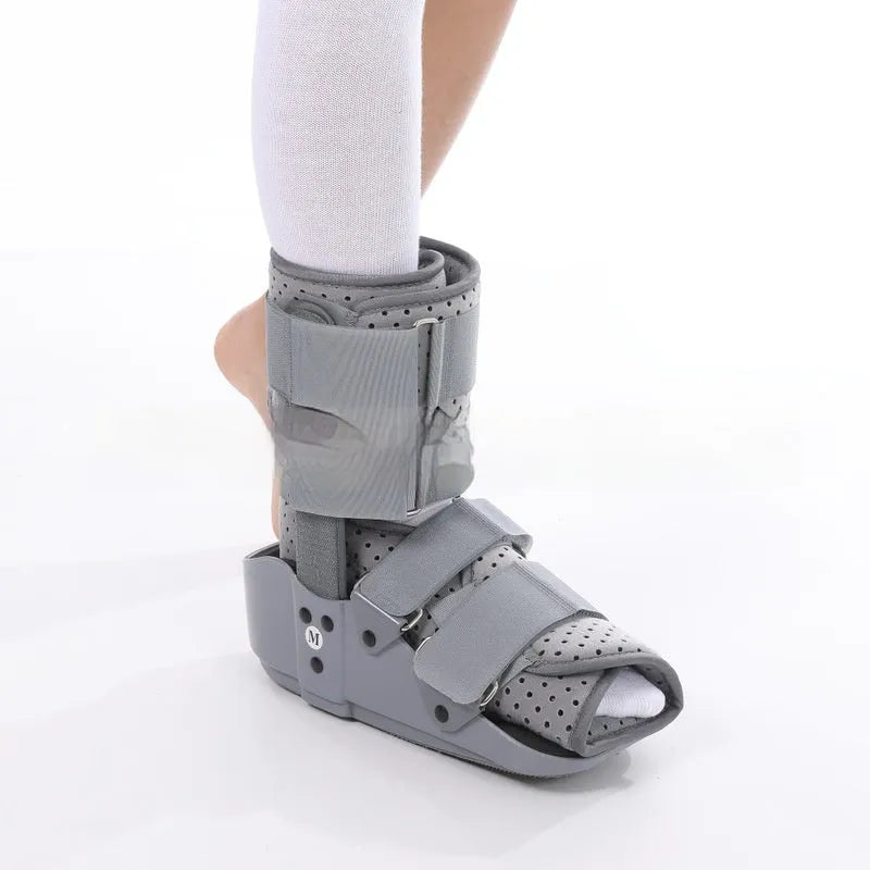 Grey Achilles tendon rehabilitation walking boot with aluminium supports and nylon straps.