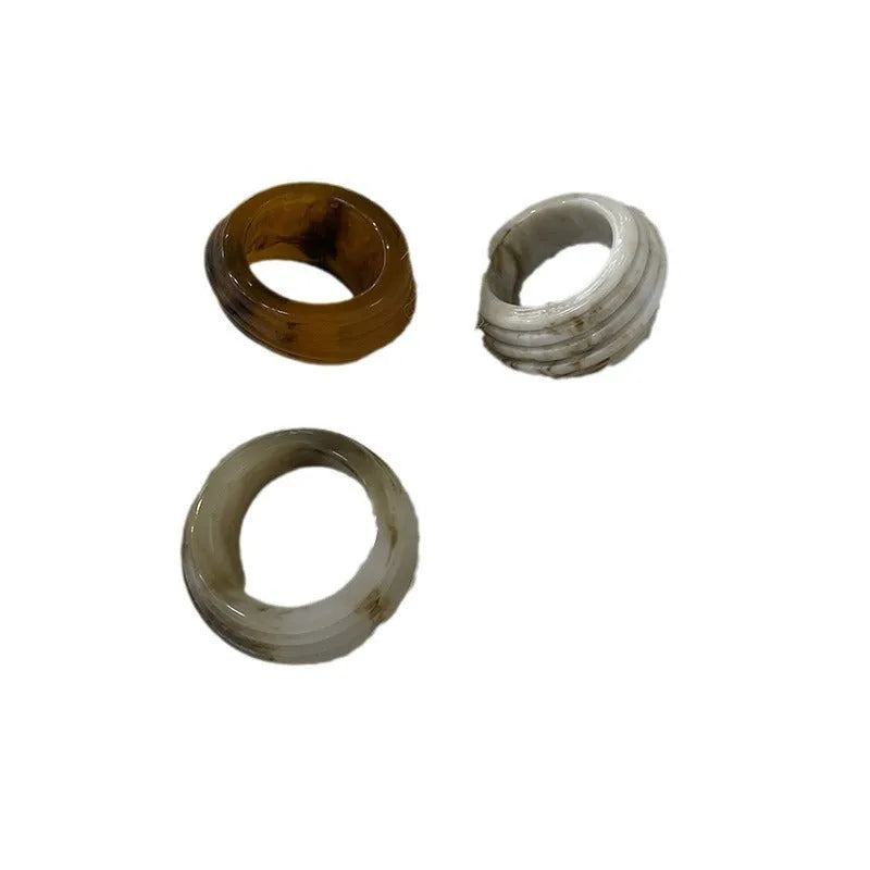 Geometric irregular resin wide ring in Maillard Brown, Smoky Brown, and Latte White colours