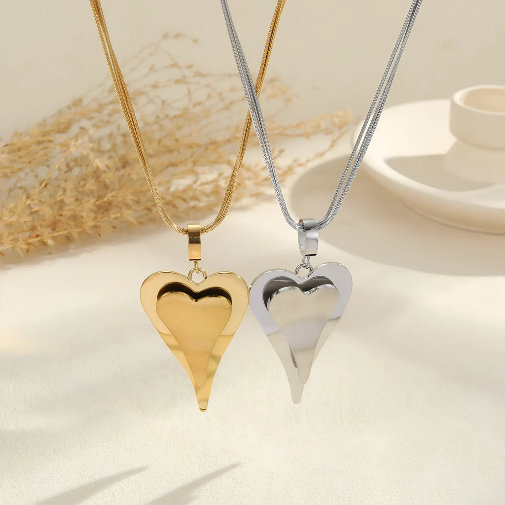Women's geometric snake bones chain necklace with double heart design in gold or steel finish