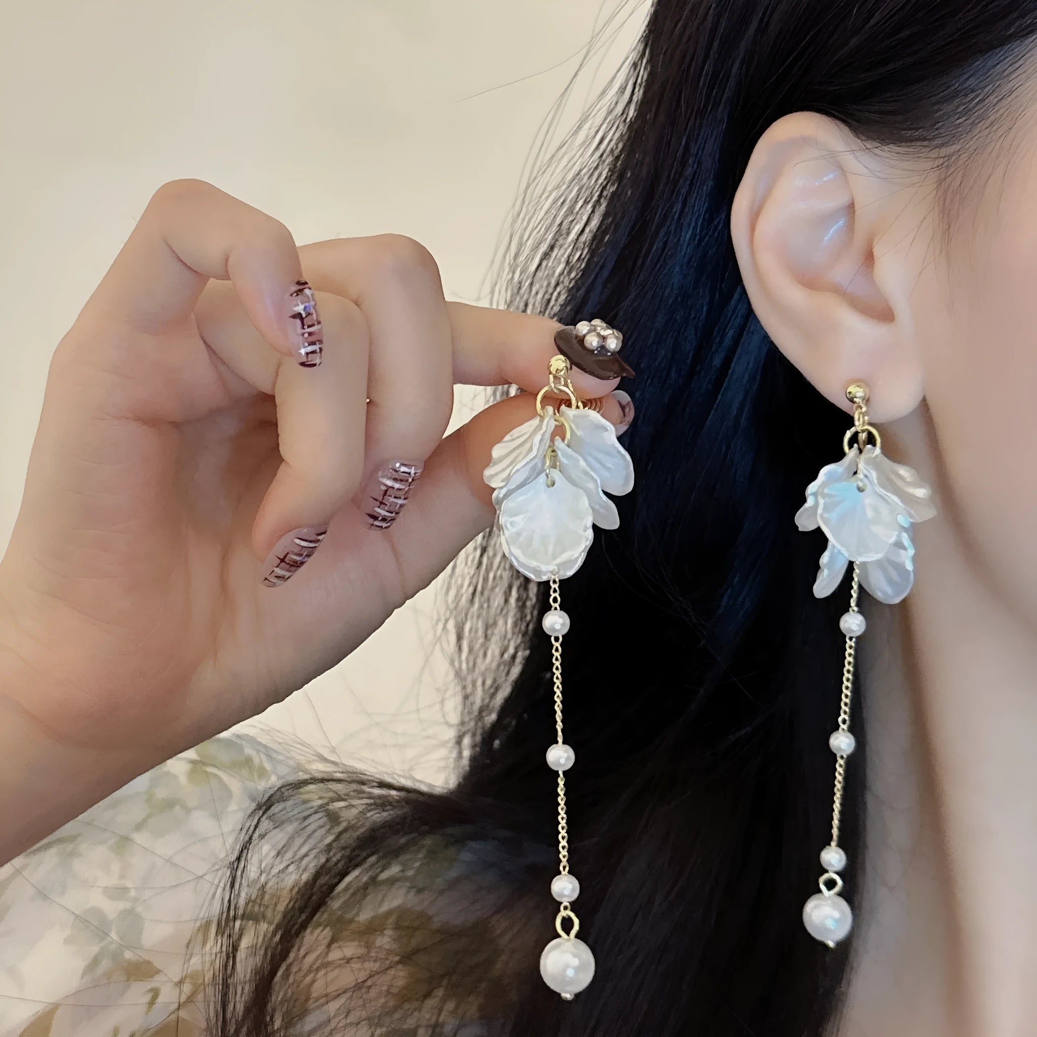 Women's acrylic shell pearl tassel earrings showing 8.8cm length and four ear clip options