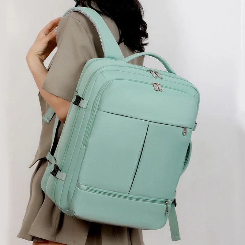 Waterproof Oxford cloth backpack in multiple colours showing front pockets and 15.6-inch laptop capacity