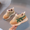 Children's white casual sneaker with Velcro closure showing synthetic leather upper and rubber sole