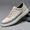 Men's grey low-top casual leather skate shoes with a round toe and flat rubber sole.