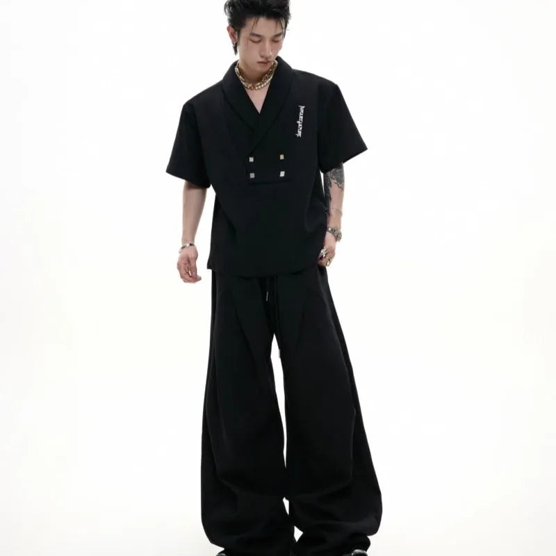 Men's dark grey V-neck sports suit with metal embellished jacket and matching athletic shorts