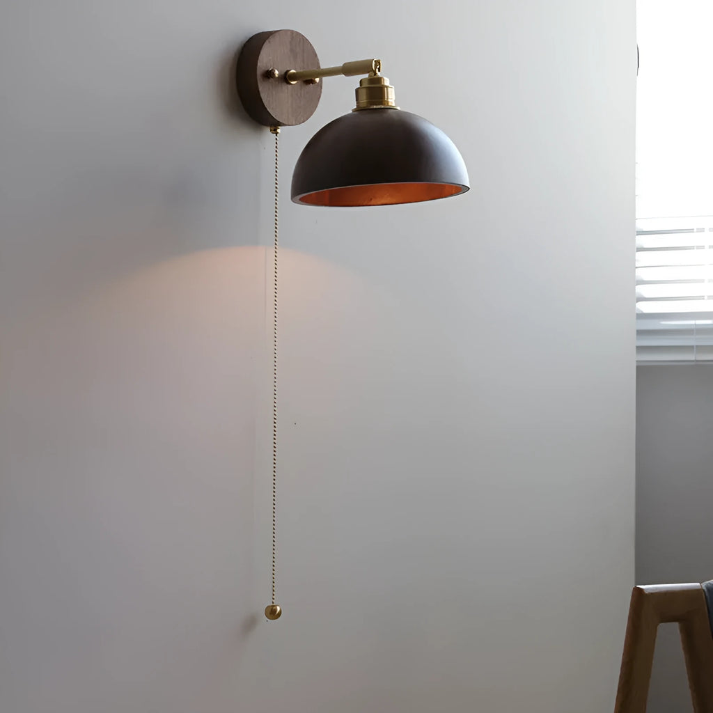 Inn Niche walnut-colour Nordic wall lamp mounted above a bedside table
