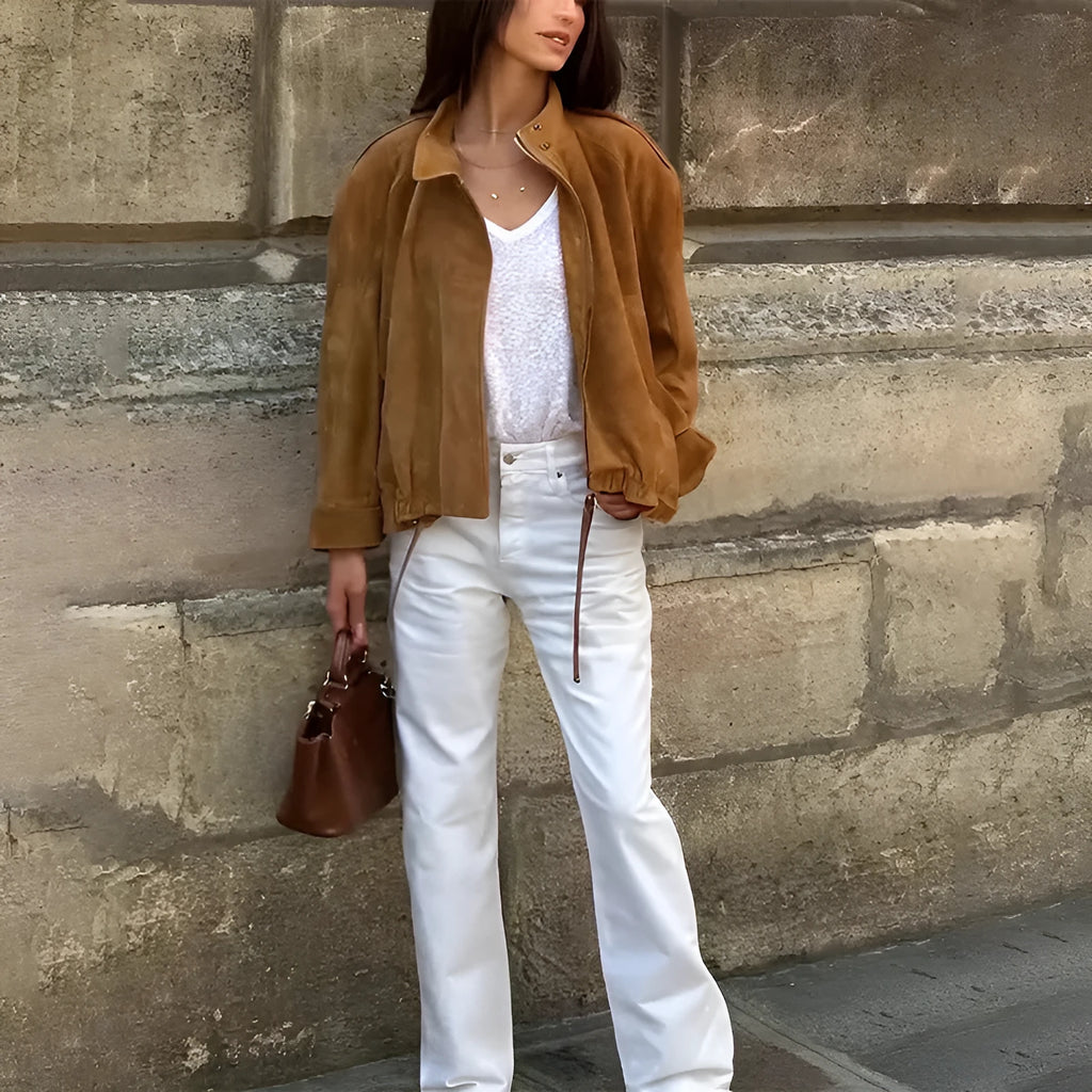 Loose-fit solid colour polyester jacket with long sleeves on a model.
