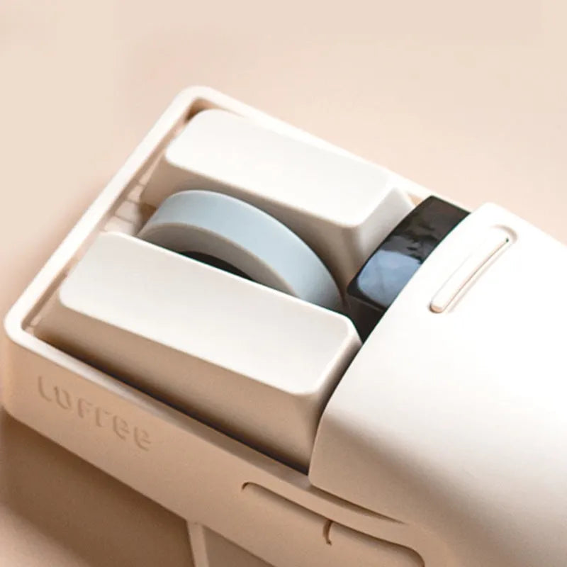 Xiaoqiao Tofu colour wireless mouse with 7 buttons and scroll wheel on plain background