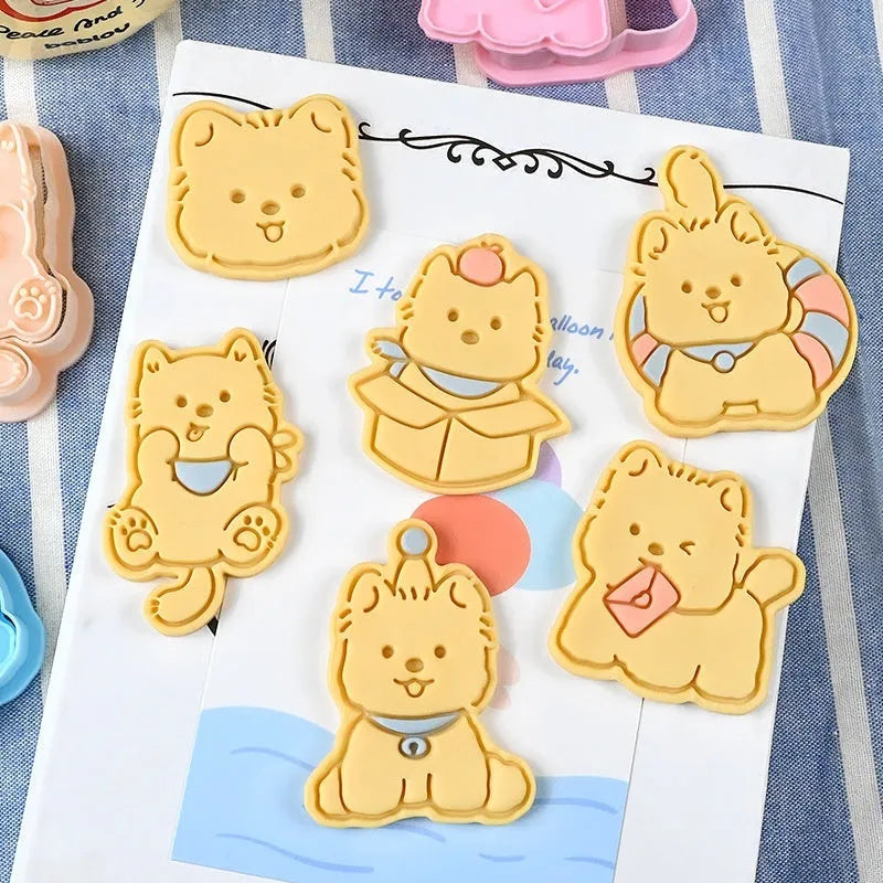Three-dimensional plastic biscuit mould with cartoon puppy designs including birthday hat and swimming ring patterns