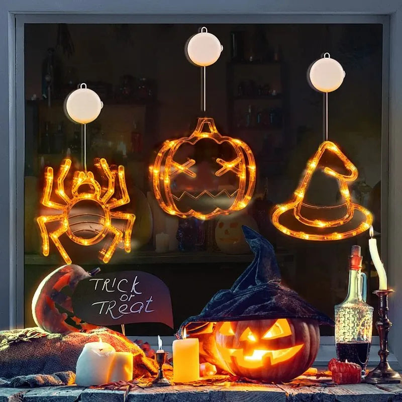 Halloween window hanging LED lights set with spider and pumpkin designs using suction cup installation