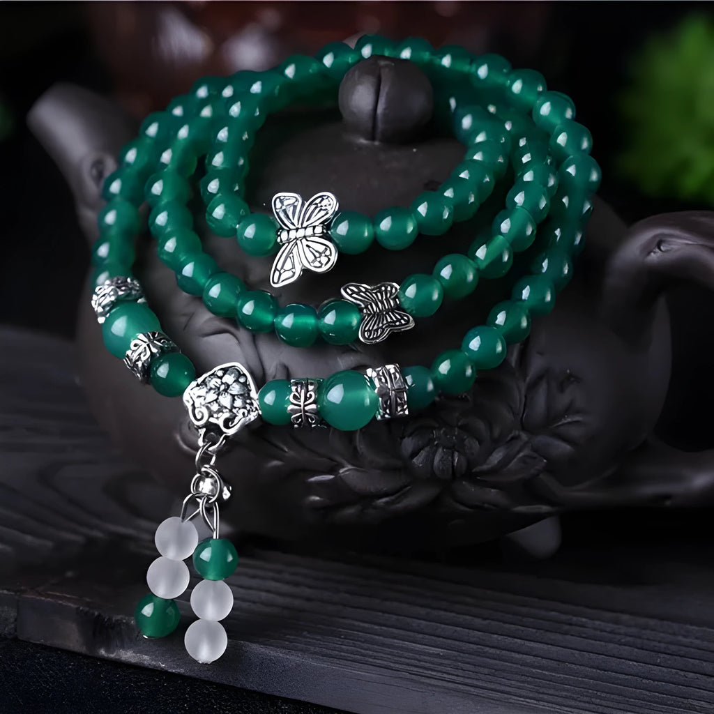 Natural green agate chain multi-layer bracelet with 6mm beads on a woman's wrist