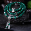 Natural green agate chain multi-layer bracelet with 6mm beads on a woman's wrist