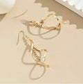 Gold electroplated alloy earrings with spiral geometric ellipse design for women
