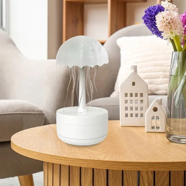 White resin jellyfish aromatherapy diffuser with 7-colour night light and 300ml tank on a desk