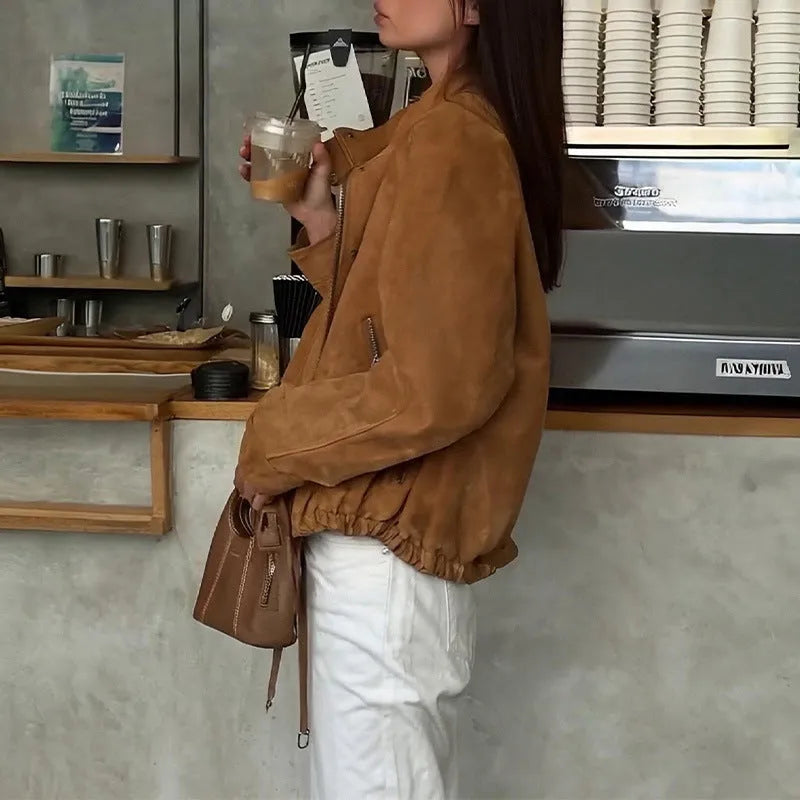 Loose-fit solid colour polyester jacket with long sleeves on a model.
